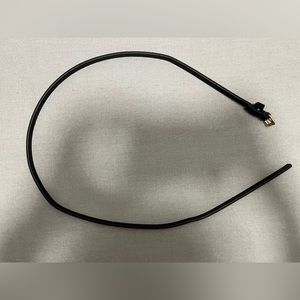 Skinny black belt with gold tone buckle